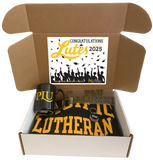 open box with "Congratulations Lutes Class of 2025" on the lid. Inside box is a quarter-zip sweatshirt, PLU mug, PLU ALUMNI decal and PLU Alumni pewter keychain.