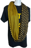 Dots & Stripes Infinity circle scarf. A black and gold scarf with stripes on one side, and dots on the other side.